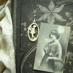 "Lady with Flowers" - Carved bone fairytale pendant. Handmade and antique.