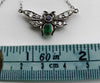 Antique pendant in the shape of a fly, with diamond, ruby, emerald stones.