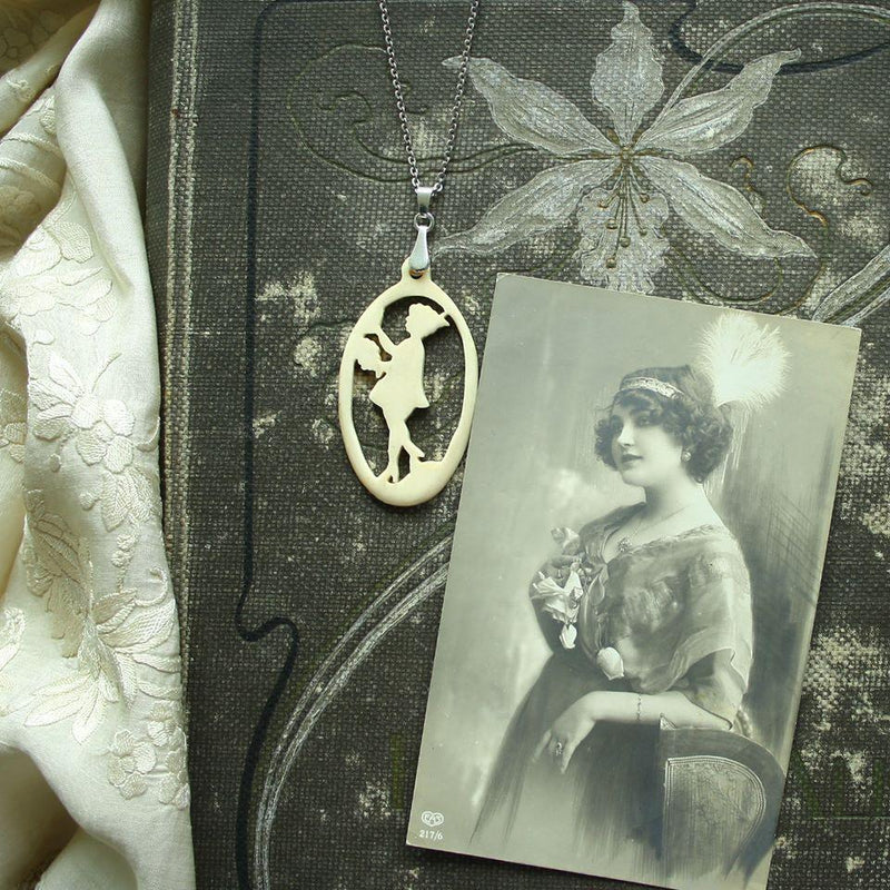 "Lady with Flowers" - Carved bone fairytale pendant. Handmade and antique.